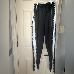 PINK sweatpants in black and white with buttons